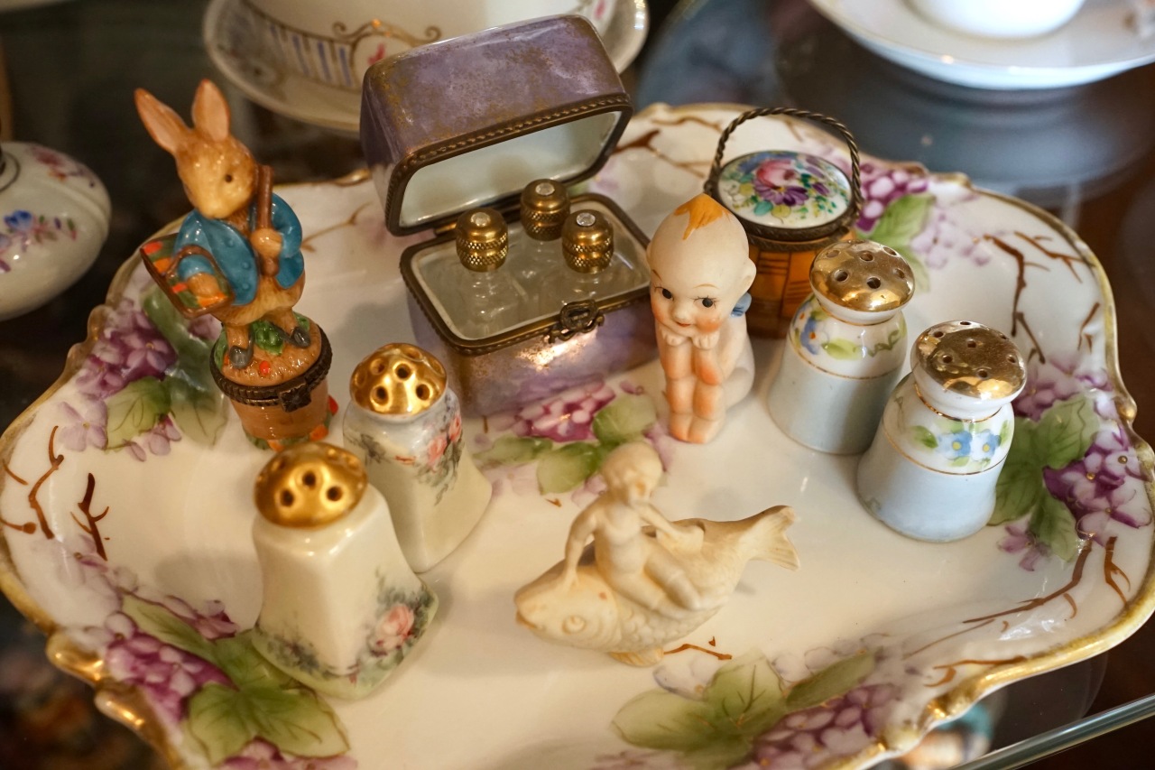 Collection of miniature porcelain trinkets grouped together