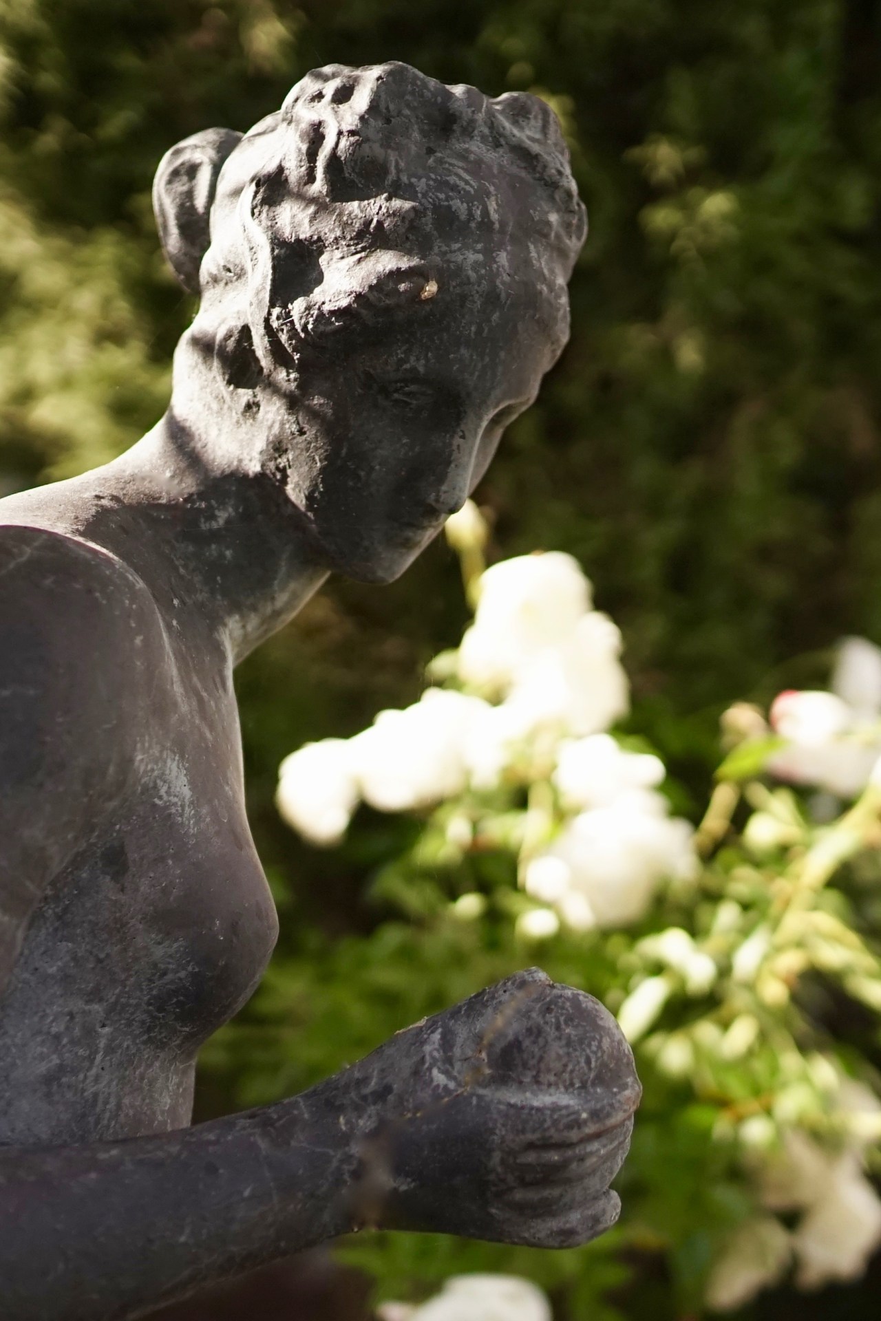Statue overlooking pool in Southern California Droughtscape